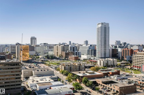 Expansive cityscape with a diverse architectural landscape, featuring high-rise structures and urban green spaces - #1902 10388 105 St Nw, Edmonton, AB 