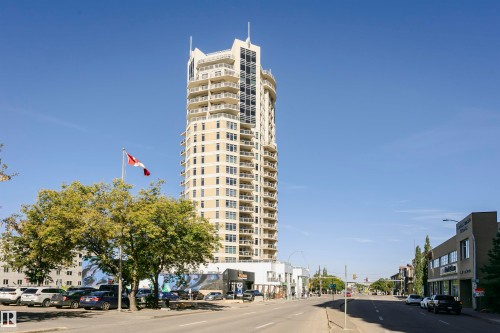 High-rise building featuring a light-toned exterior, multiple levels of balconies, and expansive window lines - #1902 10388 105 St Nw, Edmonton, AB 