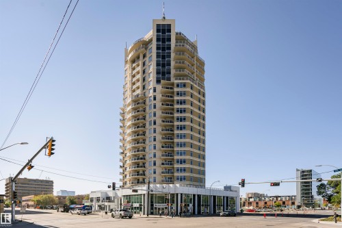 High-rise building with a light-colored facade, multiple stories, and individual balconies - #1902 10388 105 St Nw, Edmonton, AB 