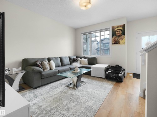 209 Desrochers Boulevard Sw, Edmonton, AB - Indoor Photo Showing Living Room