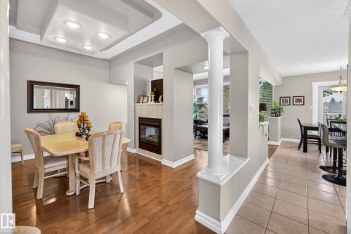 12 Otter Crescent, St. Albert, AB - Indoor Photo Showing Dining Room With Fireplace
