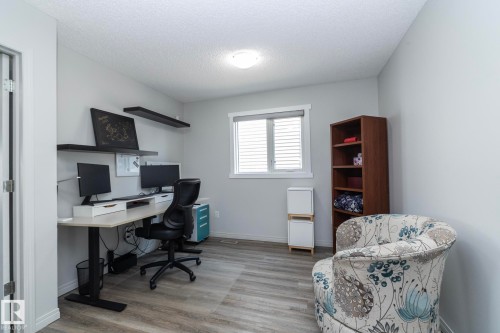 Room featuring wood-finish flooring, a window with blinds, and light gray walls - 1640 Chapman Way Sw, Edmonton, AB - Indoor Photo Showing Office
