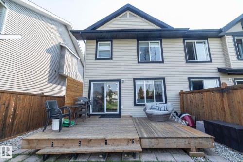 Rear exterior featuring a spacious wooden deck with steps - 1640 Chapman Way Sw, Edmonton, AB - Outdoor With Deck Patio Veranda With Exterior
