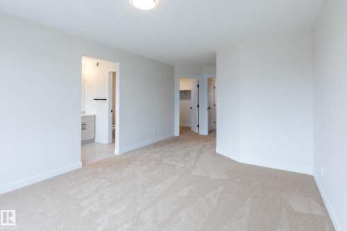 Plush carpeting and bright white walls - 6306 65 Ave, Beaumont, AB 