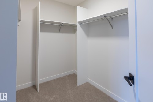 Built-in shelving with hanging rods - 6306 65 Ave, Beaumont, AB 