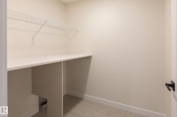 Built-in countertop with wire shelving and tiled flooring - 