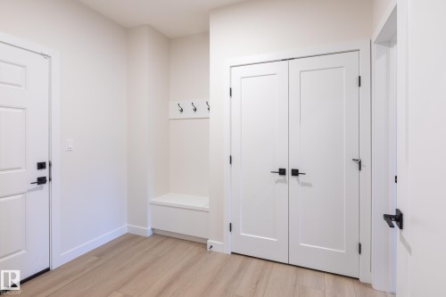 Light wood-finish flooring - 6306 65 Ave, Beaumont, AB 