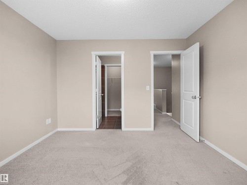Neutral-toned walls and light-colored carpeting - #162 603 Watt Bv Sw, Edmonton, AB 