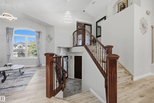 Entrance foyer with glass-insert front door and tiled floor - 10819 175 Avenue Nw, Edmonton, AB 