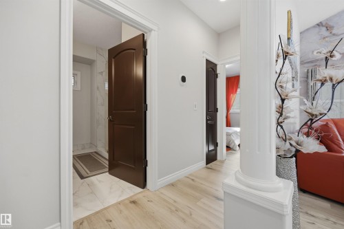 Main floor hallway leading to 2 bedrooms and 3 PC bath with shower - 10819 175 Avenue Nw, Edmonton, AB 