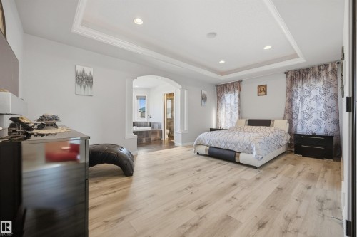 Exceptionally large and private primary bedroom with 4 PC ensuite, ambient lighting, and large walk-in closet - 10819 175 Avenue Nw, Edmonton, AB 