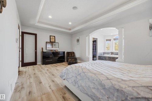 Exceptionally large and private primary bedroom with 4 PC ensuite, ambient lighting, and large walk-in closet - 10819 175 Avenue Nw, Edmonton, AB 