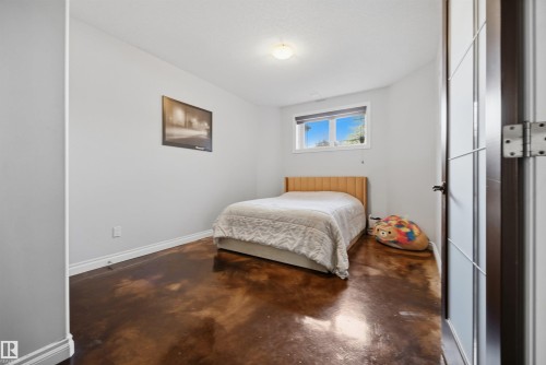 Large basement bedroom with French doors, in-floor heating and large closet - 10819 175 Avenue Nw, Edmonton, AB 