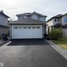Two-story residence with a gray siding exterior - 910 Oakland Boulevard, Devon, AB 