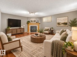 Hardwood flooring throughout, a gas fireplace with a wood mantel, and recessed lighting fixtures - 