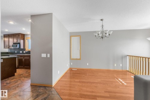 Hardwood flooring in the main living area - 1271 Ormsby Lane Nw, Edmonton, AB 