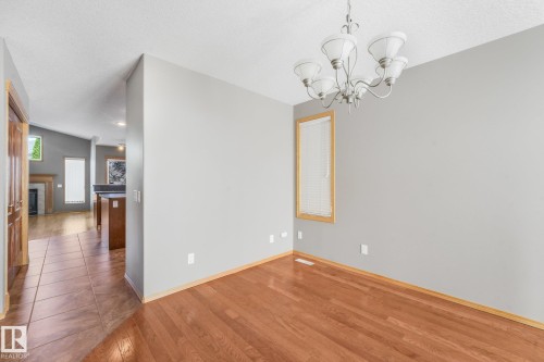 Hardwood-style flooring with baseboard trim - 1271 Ormsby Lane Nw, Edmonton, AB 