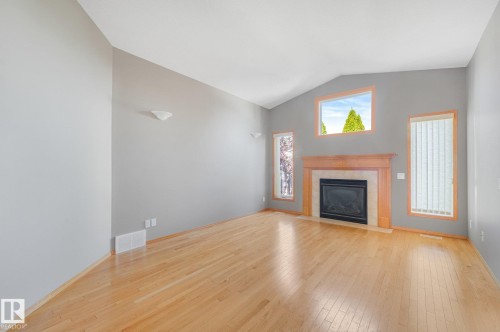 Vaulted ceiling with light wood-finish flooring - 1271 Ormsby Lane Nw, Edmonton, AB 