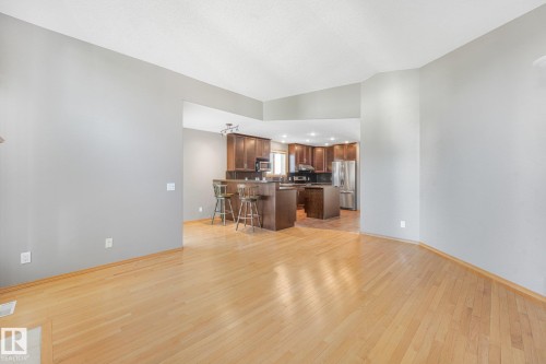 Light wood-finish flooring with a neutral wall color - 1271 Ormsby Lane Nw, Edmonton, AB 