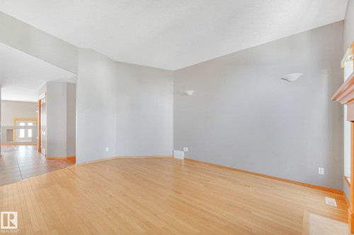 Light wood-finish flooring, neutral wall tones, and recessed ceiling lighting - 1271 Ormsby Lane Nw, Edmonton, AB 