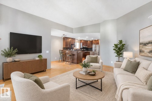 Vaulted ceiling with light gray walls and wood-finish flooring - 1271 Ormsby Lane Nw, Edmonton, AB 