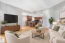 Vaulted ceiling with light gray walls and wood-finish flooring - 1271 Ormsby Lane Nw, Edmonton, AB 
