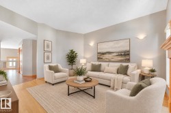 Vaulted ceilings, light-toned walls, sconce lighting, and wood-finish flooring - 