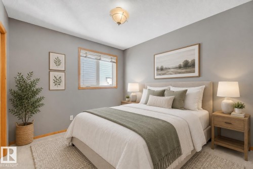 Recessed window with wood-finish trim, ceiling-mounted light fixture, and light-toned wall paint - 1271 Ormsby Lane Nw, Edmonton, AB 