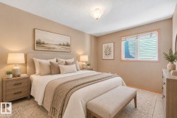 Plush carpeting, neutral wall tones, window with horizontal blinds, and a built-in overhead light fixture - 