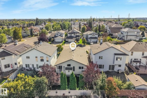 Two-story property with a light-colored exterior and a dark shingle roof - 1271 Ormsby Lane Nw, Edmonton, AB 