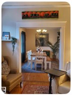 Hardwood flooring throughout, crown molding, and cased openings - 