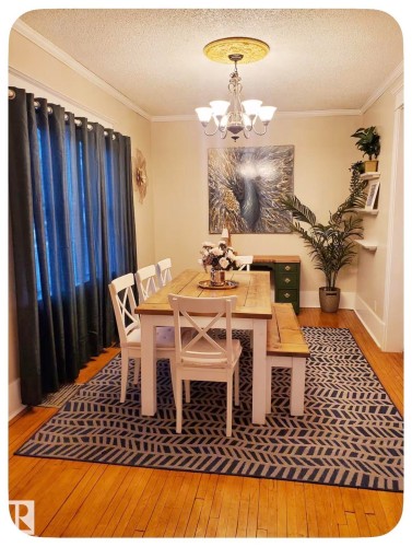 Hardwood flooring, crown molding, and a decorative ceiling medallion with a chandelier - 10649 125 Street Nw, Edmonton, AB 