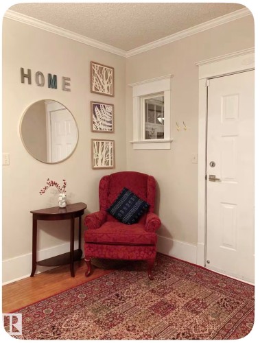 Wood-finish flooring with crown molding and window trim detail - 10649 125 Street Nw, Edmonton, AB 