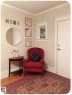 Wood-finish flooring with crown molding and window trim detail - 10649 125 Street Nw, Edmonton, AB 