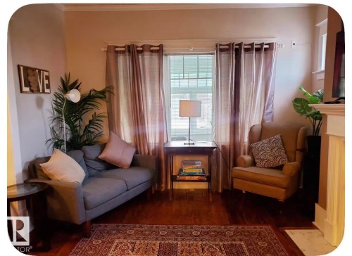 Wood-finish flooring with a decorative area rug - 10649 125 Street Nw, Edmonton, AB 
