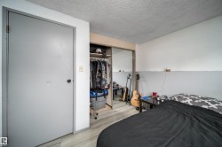 Wood-finish flooring with a mirrored closet door - 