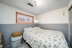 Wood-finish flooring with a horizontal window featuring blinds - 