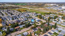 Residential neighborhood setting with mature trees and paved streets - 