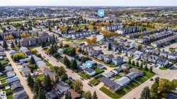 Residential neighborhood featuring detached homes, multi-family buildings, and mature landscaping - 