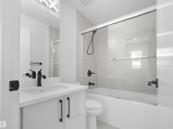 White vanity with integrated rectangular sink and matte black faucet - 