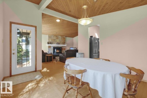 Wood-finish vaulted ceiling with exposed beams - 15012 77 Avenue Nw, Edmonton, AB 