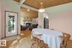 Wood-finish vaulted ceiling with exposed beams - 