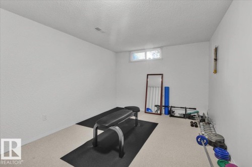 Carpeted flooring, white painted walls, and a single window - 15012 77 Avenue Nw, Edmonton, AB 
