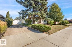 Mature trees and landscaping frame the property - 