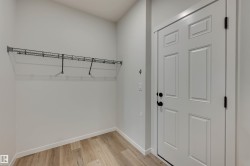 mud room from garage has door to close-off from entryway...because nobody needs to judge you and see your shoes and coats. - 