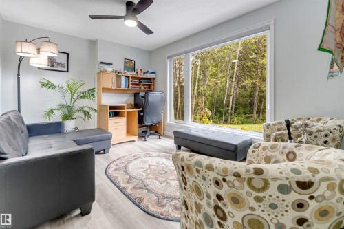 Recessed lighting, ceiling fan, expansive windows, wood-finish flooring, and light-toned walls - #37 23020 Township Road 522 Rd, Rural Strathcona County, AB 