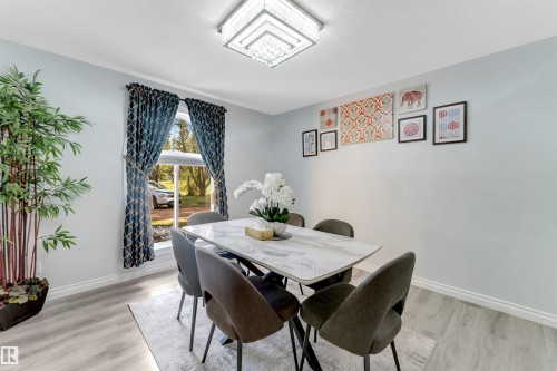 Recessed ceiling light fixture, wood-finish flooring, and a window with trim - #37 23020 Township Road 522 Rd, Rural Strathcona County, AB 