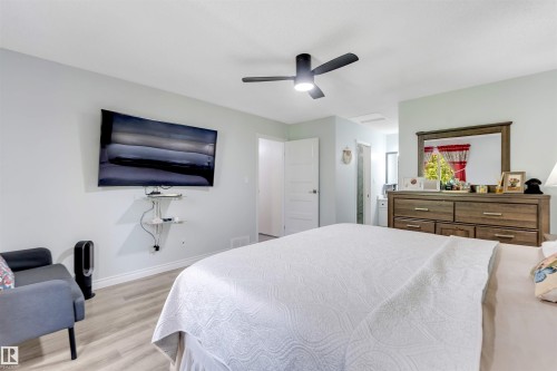 Wood-finish flooring, ceiling fan with integrated lighting, and a built-in wall shelf - #37 23020 Township Road 522 Rd, Rural Strathcona County, AB 