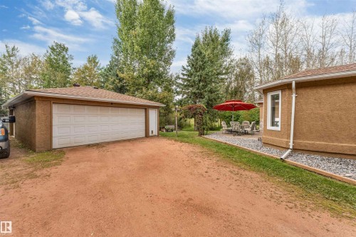 Detached garage with two garage doors, shingle roof, and a side entry door - #37 23020 Township Road 522 Rd, Rural Strathcona County, AB 