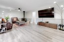 Recessed ceiling lighting, wood-finish flooring, ceiling fan, freestanding wood-burning stove, and wall-mounted television - #37 23020 Township Road 522 Rd, Rural Strathcona County, AB 